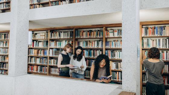 Students reading in the library at Murray Edwards College, Cambridge