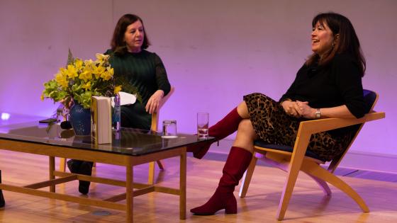Two women in conversation on a stage