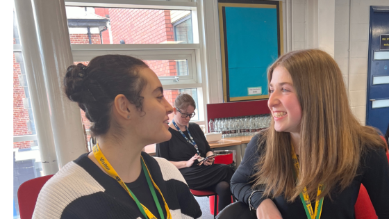 Two Year 12 students smile at the Manchester Access Conference